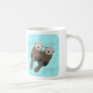 手のマグのかわいいカワウソのカップルのマグを握っているカワウソ コーヒーマグカップ