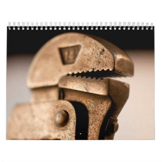 手はカスタムによって印刷されるカレンダーに用具を使います カレンダー