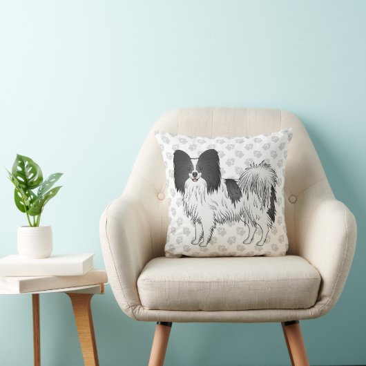 手を使った白黒のパピヨンの漫画の犬 クッション (椅子)