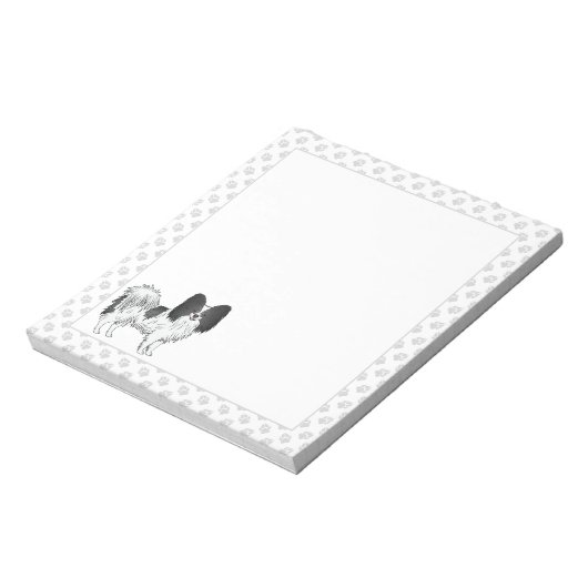 手を使った白黒のパピヨンの漫画の犬 ノートパッド (回転)