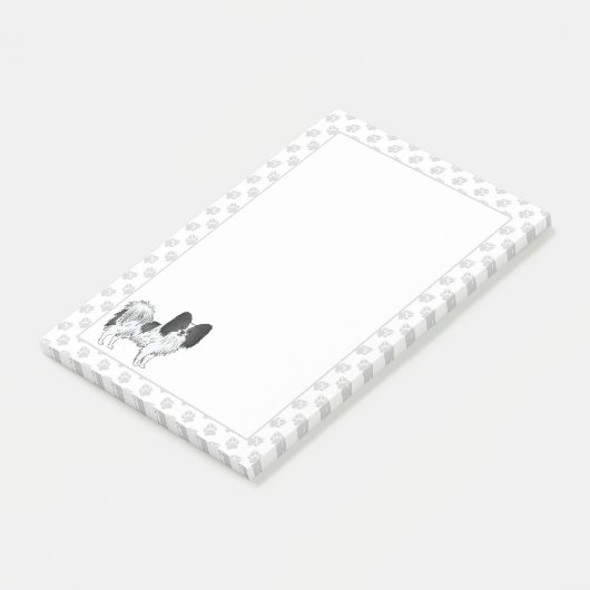 手を使った白黒のパピヨンの漫画の犬 ポストイット (アングル)