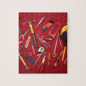 手持ち型用具および道具袋の赤の背景 ジグソーパズル (縦)