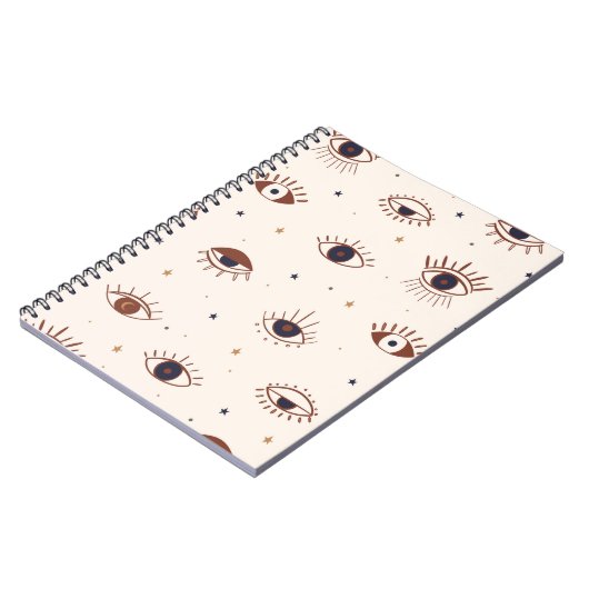 手描き目の神秘的なシームレスなパターン。イブードアイ ノートブック (左側)
