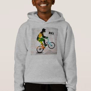 抽象的なペンキのBMXのライダーは文字とのスクエアをはね飛ばします