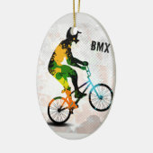 抽象的なペンキのBMXのライダーは文字とのスクエアをはね飛ばします セラミックオーナメント (左)