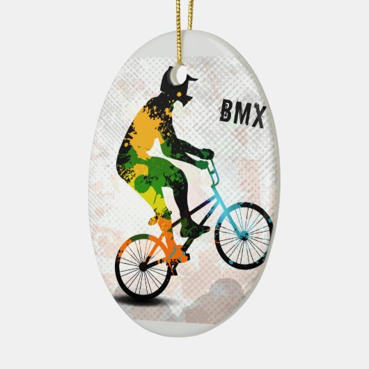 抽象的なペンキのBMXのライダーは文字とのスクエアをはね飛ばします セラミックオーナメント (左)