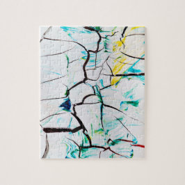 抽象芸術が緑の黄色い青で割れた ジグソーパズル