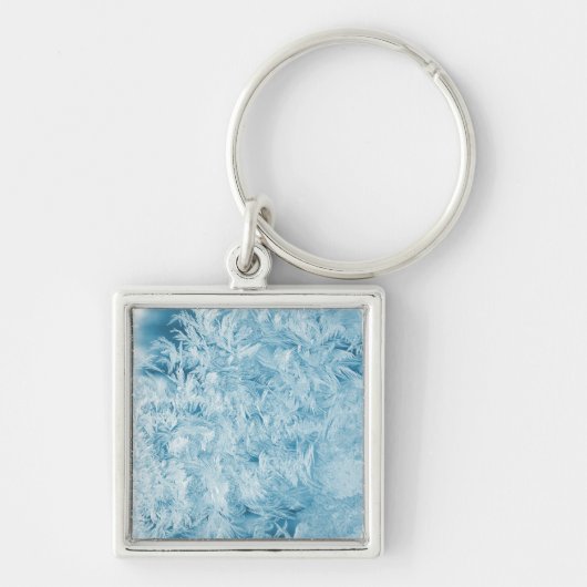 抽象芸術の青い羽と雪 キーホルダー (正面)