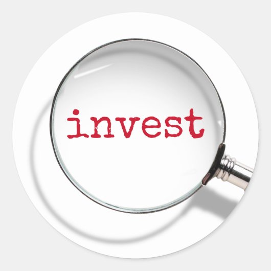 拡大鏡の下のInvestの文字 ラウンドシール (正面)