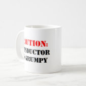 指揮者が不機嫌である コーヒーマグカップ (正面左)