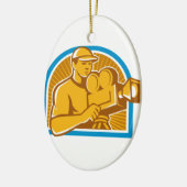 撮影技師の映画制作班のヴィンテージの映画用カメラのレトロ セラミックオーナメント (左)