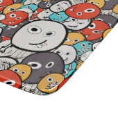 数々の色ドードルモンスター顔 カッティングボード (角)