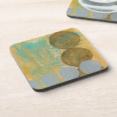 数値を含む濃い茶色と灰色の円 コースター (左側)