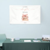 新しい章が始まる ピンクの蝶結びの本 赤ちゃんのお披露目 横断幕 (トレードショー)