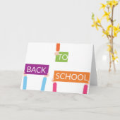 新学期の看板を持つ手 カード (黄色い花)