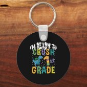 新学期1年生のディーノをつぶす準備ができている キーホルダー (正面)