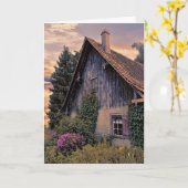 日の出の白熱の古いヨーロッパの家 カード (黄色い花)