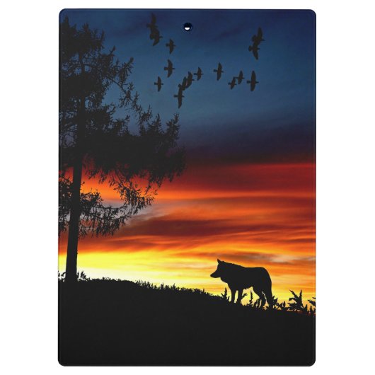 日没のオオカミと鳥と木の黒いシルエット クリップボード (裏面)