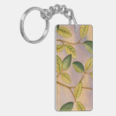 日没の背景の緑および黄色の葉 キーホルダー (正面左)