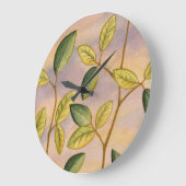 日没の背景の緑および黄色の葉 ラージ壁時計 (傾斜)