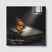 （昆虫）オオカバマダラ、モナーク・バタフライ・オン・ア・神聖な聖書 ゲストブック (正面)