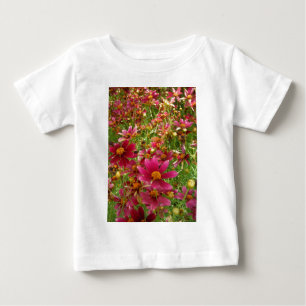 明るいホットピンクと黄色のデイジーの花 ベビーTシャツ