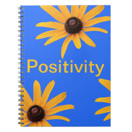 明るい日黄色の花オン王室のブルー ノートブック