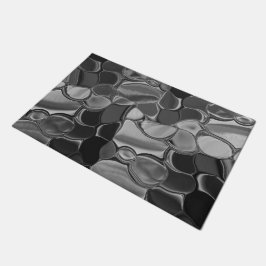 明るい灰色と暗い丸い形状。 ドアマット