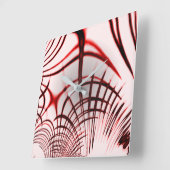 明るい背景に交差する赤い曲線のトレース スクエア壁時計 (傾斜)