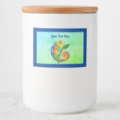 明るい色の漫画かわいいトカゲの葉縁ど青 フードラベル (正面)