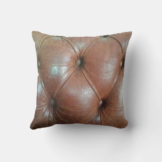 明るい茶色のレザーソファの表面、テクスチュレアブソラ クッション (裏面)