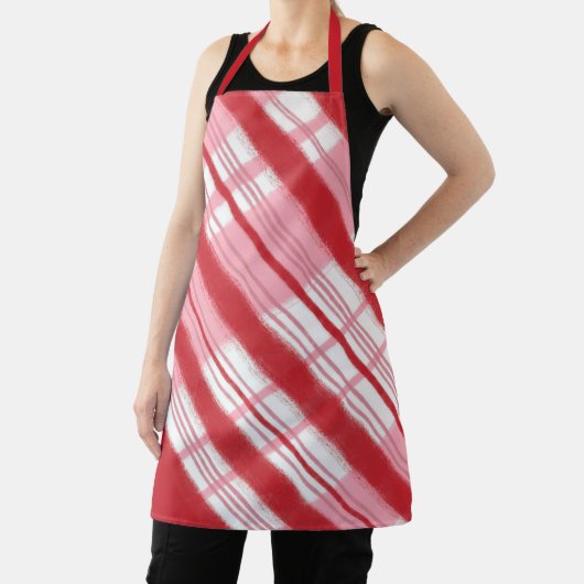 明るい赤とピンクのホリデーキャンディーケーンプレイド エプロン (インサイチュ)