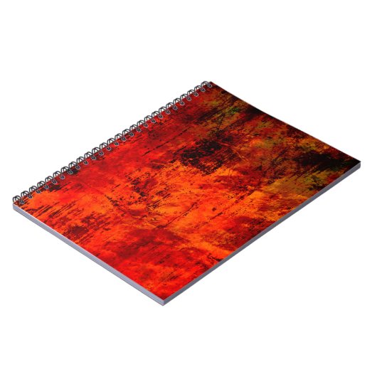 明るい赤の汚れた古い黒の皮を剥いた背景。ホール ノートブック (左側)