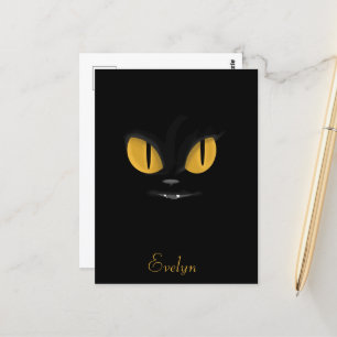 明るい黄色の目を持つかわいい黒猫 ポストカード