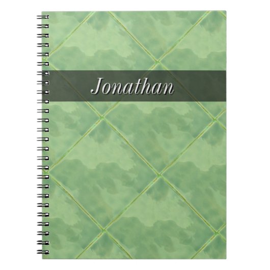 明白なタイルの陶磁器の表面の灰色文字 ノートブック (正面)