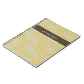 明白なタイルの陶磁器の表面の黄色文字 ノートブック (左側)