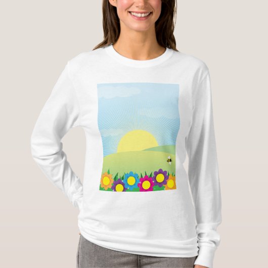 春の牧場の太陽光とカラフルな花 Tシャツ (正面)