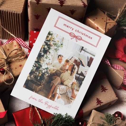暖かい赤の白いかわいらし弓の写真メリークリスマス シーズンカード