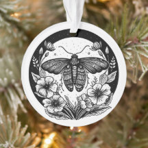 暗いアカデミガの蛾と花