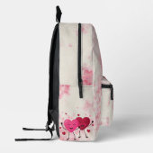 暗くなった水の色のフローラプリントと漫画ハート プリントバックパック (左)