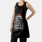 最も可能性が高いサンタ食べスクッキー家族のクリスマス エプロン (インサイチュ)
