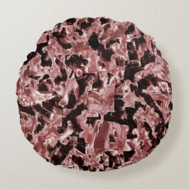 最も暗い赤の上に浮いている銅または岩のブレード ラウンドクッション