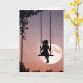 月と一緒にスイング考え中の女の子 カード (黄色い花)