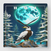 月に照らされた冬の空の下に止まったワシ スクエア壁時計 (正面)