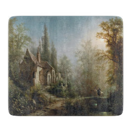 月の明るい夜のカントリー・チャペルと馬のライダー カッティングボード