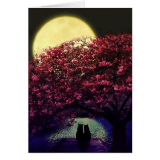 月光を賞賛している2匹の猫