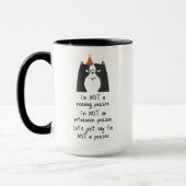 朝おもしろいの人ではない マグカップ (左)