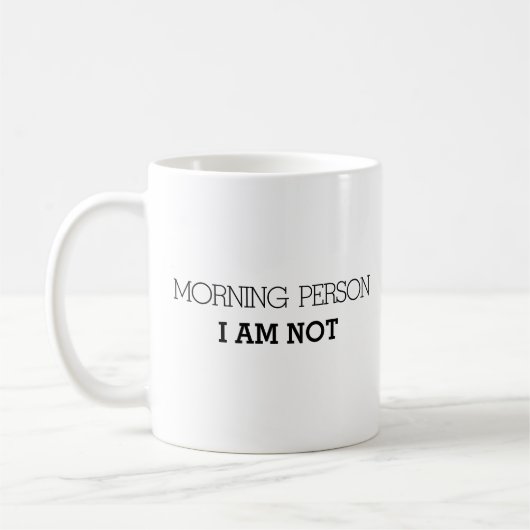 朝ではない人おもしろい コーヒーマグカップ (左)