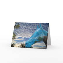 朝の空とペイントされた馬の合成写真