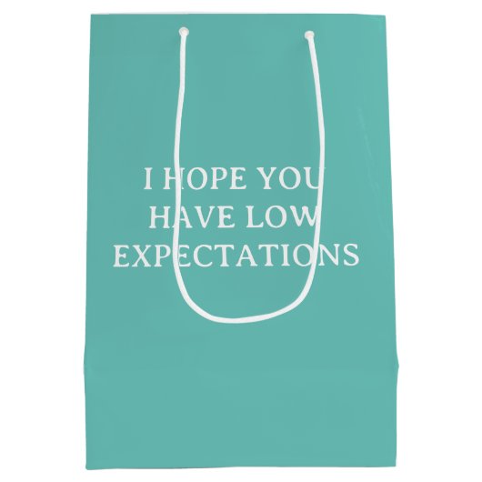 期待の低いユーモアおもしろい ミディアムペーパーバッグ (裏面)